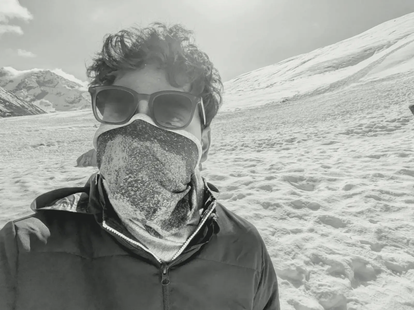 Aman in snow goggles and a neck gaiter, North Sikkim in winter (toned)