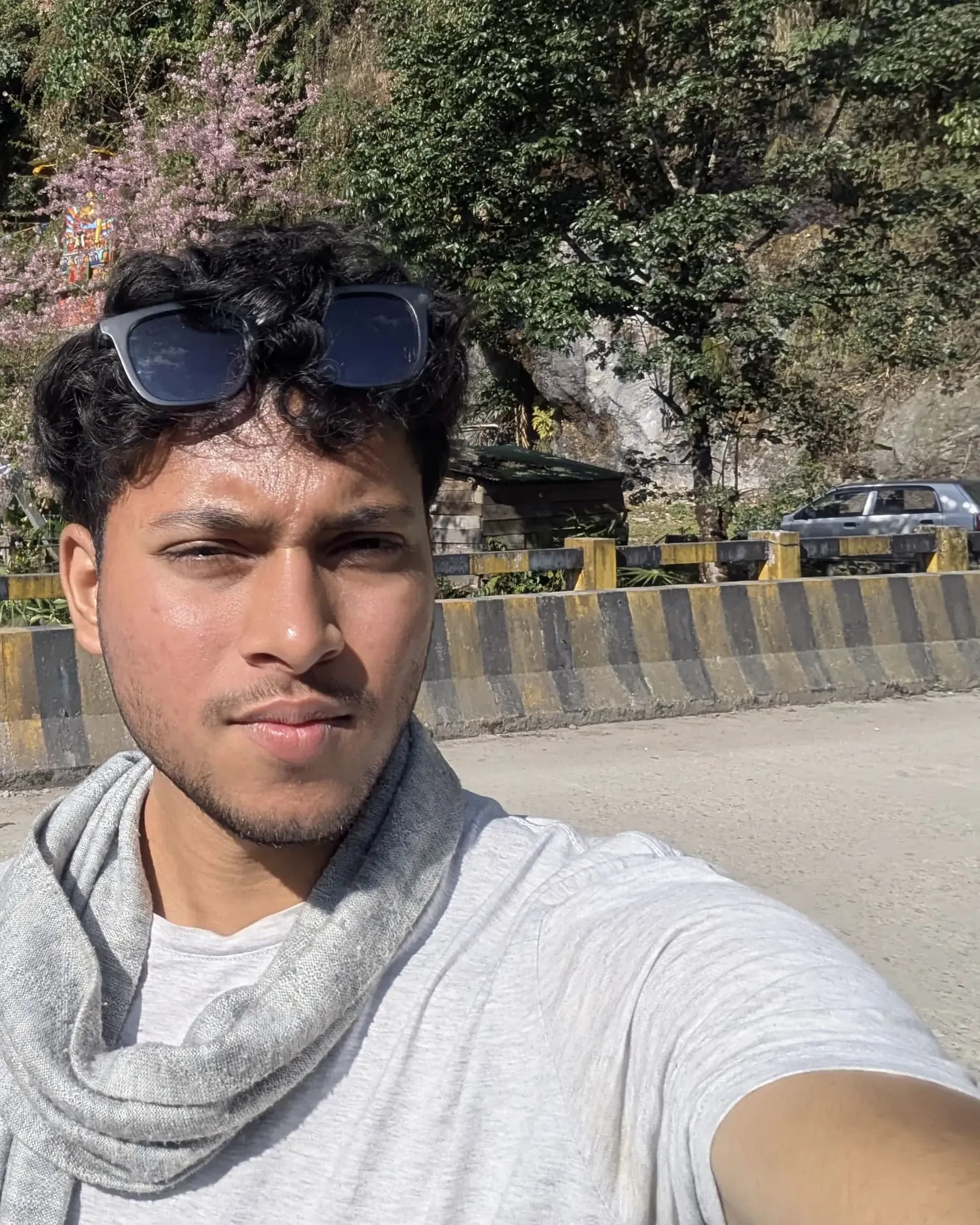 Aman at a bridge over a gorge in Sikkim